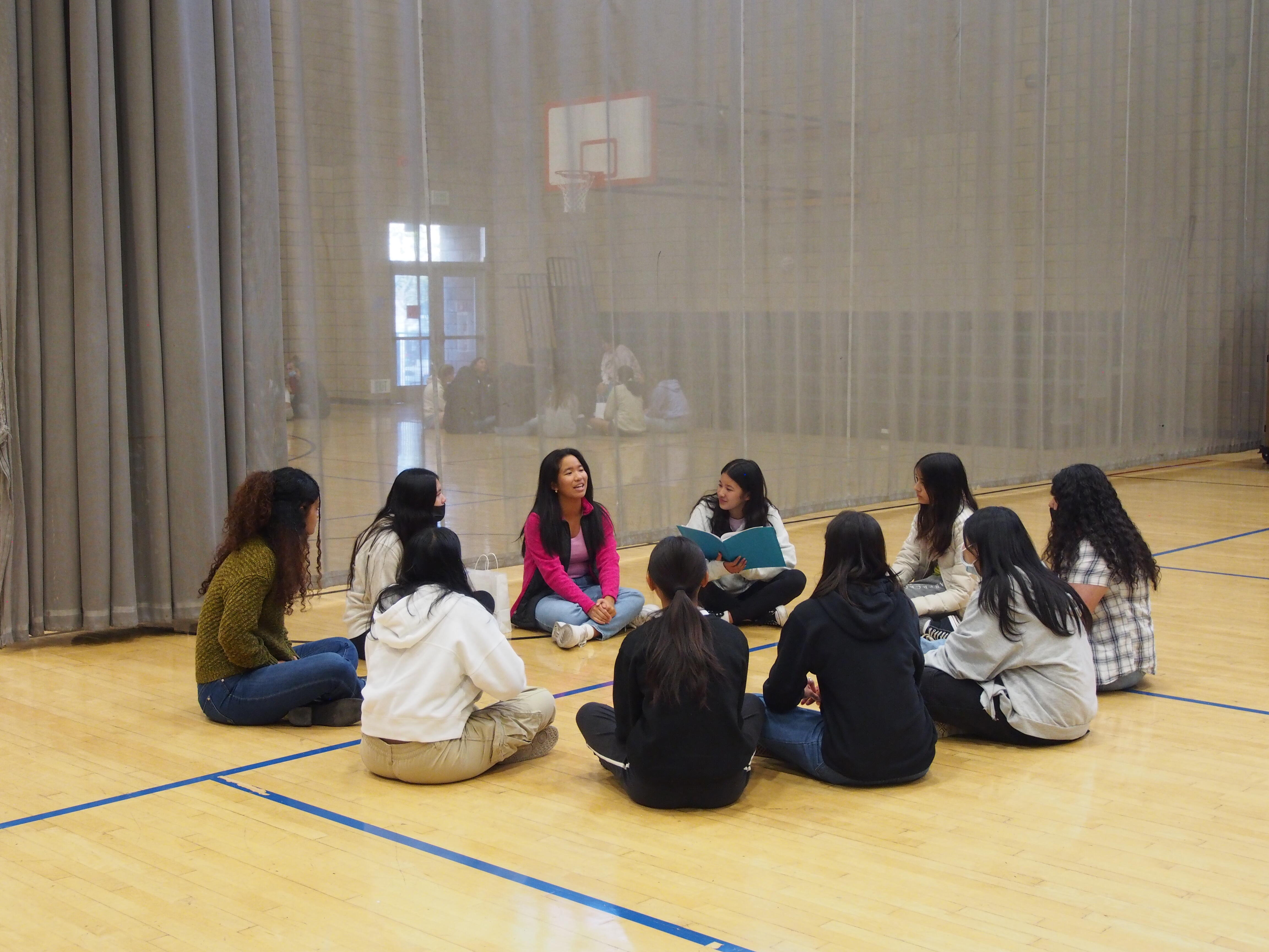 circle of students in a small group activiy